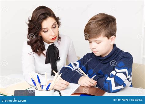 Mom Helps Her Teen Daughter To Learn Lessons Isolated On White Background Royalty Free Stock