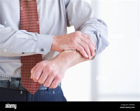 Man Rolling Up Sleeve Hi Res Stock Photography And Images Alamy