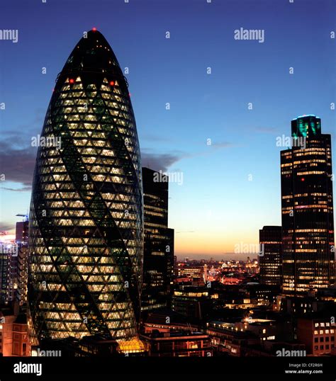 The Gherkin And Natwest Tower Buildings In London At Night Stock Photo