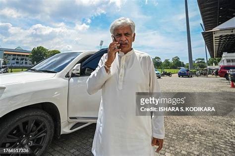 Sri Lanka's former cricket captain Arjuna Ranatunga uses his phone as... News Photo - Getty Images