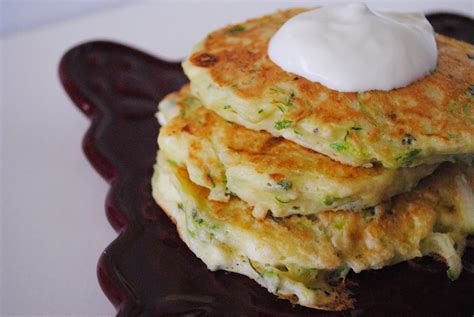 Delicious Dixie Zucchini Feta Pancakes Topped With Sour Cream