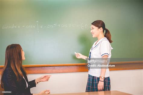 Happy Female Student And Teacher During Math Hong Kong School High Res