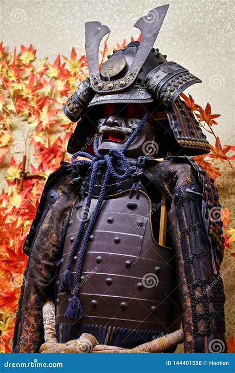 Traditional Japanese Armor With Maple Leaves Background Stock Photo