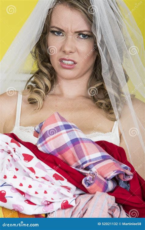 Attractive Young Bride Holding Dirty Laundry Angry And Upset Stock