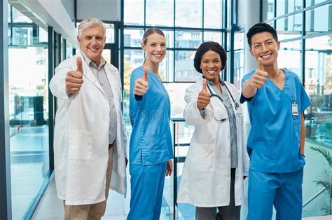 Who Doesnt Like Good Healthcare A Group Of Doctors Showing A Thumbs Up