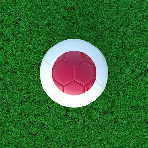 Premium Photo | Flag of japan on soccer ball with grass background