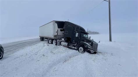 Winter Storm Diaz Buries Big Rigs In Snow In South Dakota