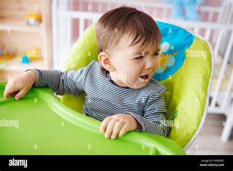 Crying Baby Boy Over Feeding Time Stock Photo Alamy