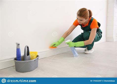 Professional Young Janitor in Uniform Cleaning Room Stock Image - Image ...