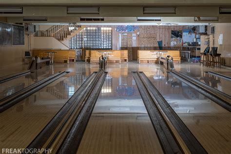 Reverse View Of An Abandoned Bowling Alley Facing The Boarded Up Door