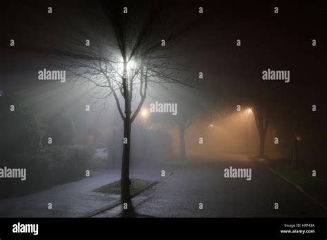 foggy street at night Stock Photo - Alamy