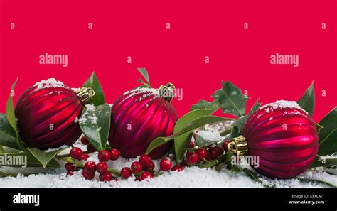 Red Christmas Border Background With Three Red Baubles And Holly In The