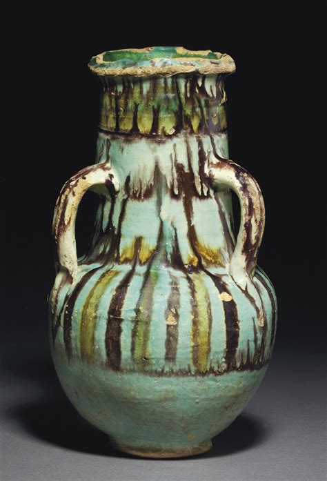 A Fatimid Fayyoum Ware Glazed Pottery Handled Jar Egypt 11th Century Christies