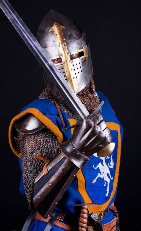 Knight posing with sword stock image. Image of armour - 13314055