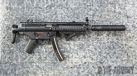 A Heckler And Koch Mp5 Navy With A Kac Suppressor And Magpul Afg Clyde