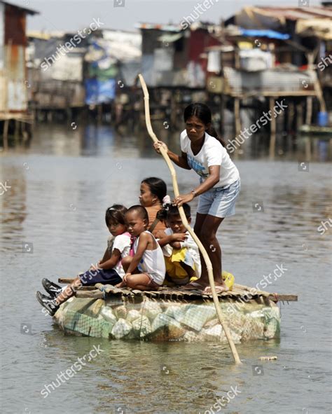 Filipino Typhoon Victims Ride Makeshift Raft Editorial Stock Photo