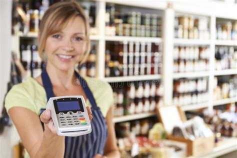 Female Sales Assistant In Clothing Store Stock Photo Image Of Clerk