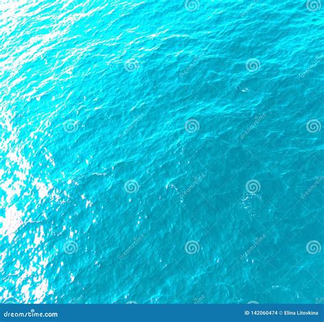 Sea Water Background in Light Blue with Sun Highlights Stock Photo ...