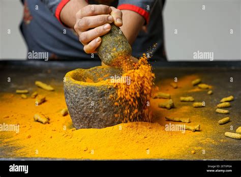 Woman Hand Powdering Indian Spices Turmeric Powder Splash Explosion