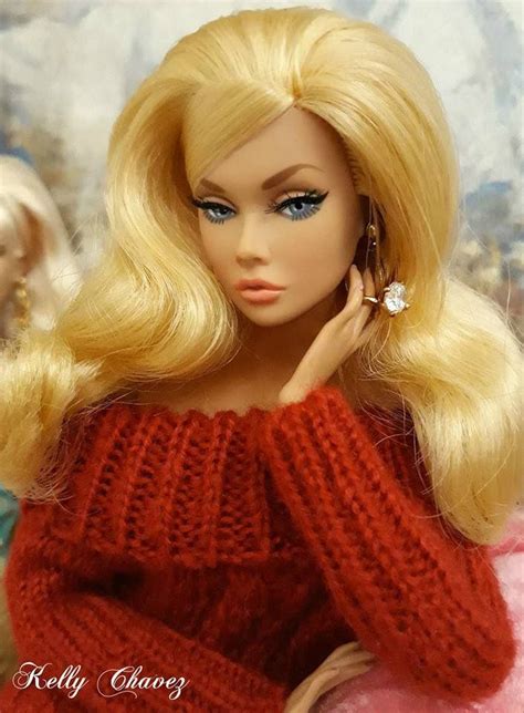 A Barbie Doll With Blonde Hair And Blue Eyes Wearing A Red Knitted