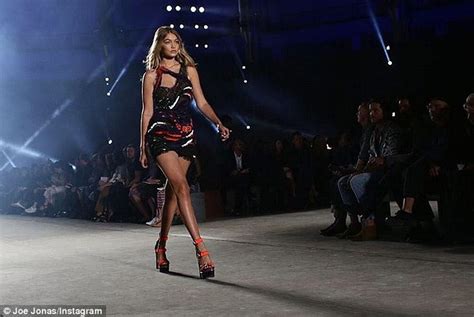 Joe Jonas Supports Girlfriend Gigi Hadid Model For Versace At Milan Fashion Week Daily Mail Online