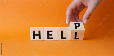 Help Vs Hell Symbol Businessman Hand Turnes Cube And Changes Word Hell