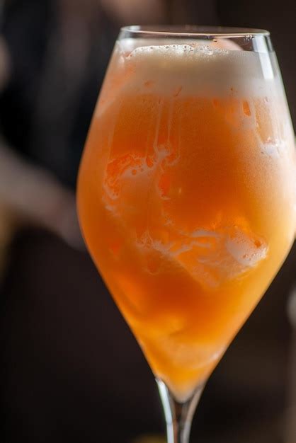 Premium Photo Ready Orange Cocktail In A Tall Glass