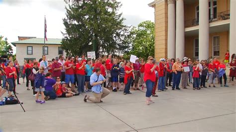 Henderson County teachers march outside historic courthouse | WLOS