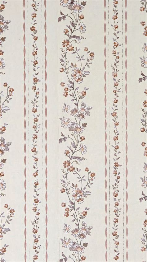 A Striped Wallpaper With Flowers And Stripes On The Bottom Along With