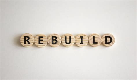 Rebuild And Build Symbol The Concept Word Rebuild On Wooden Circles