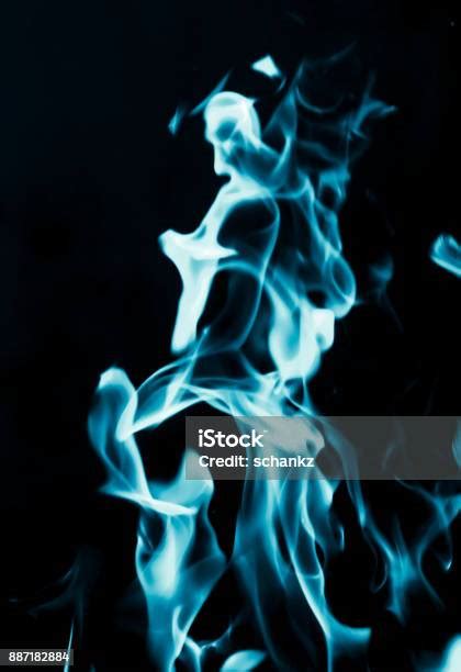 Abstract Background Of Blue Flame Fire On Black Background Stock Photo