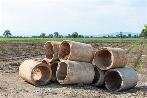 Cracked Old Sewer Pipe Located In Local River With Wastewater Coming