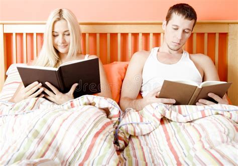 Couple Reading In Bed Stock Image Image Of Enjoyment 12892903