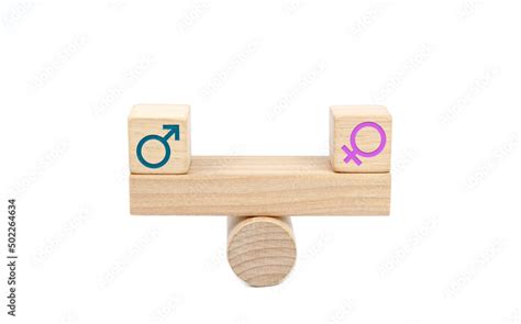 Concept Of Gender Equality Wooden Blocks With Male And Female Symbols On A Balanced Seesaw On