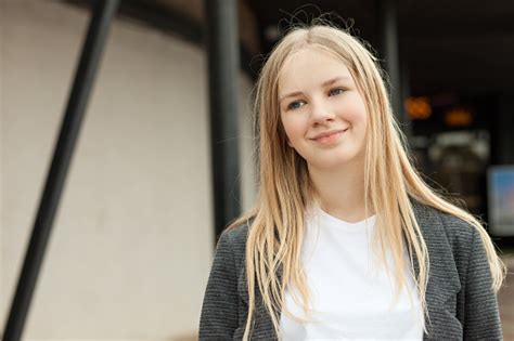 Closeup Outdoor Portrait Of A 13 Year Old Blonde Teenage Girl Stock