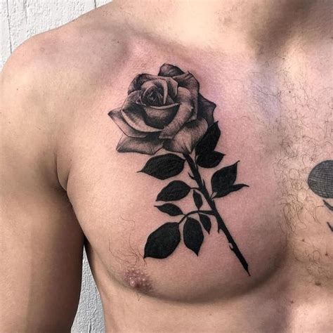 A Man With A Rose Tattoo On His Chest