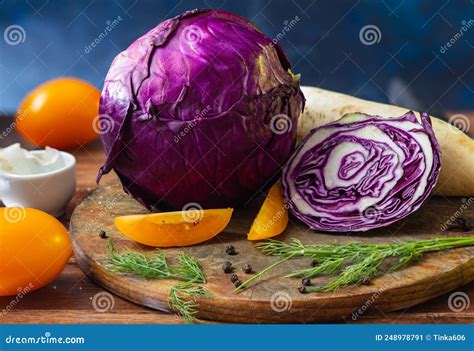 Traditional Red Cabbage With Vegetables Before Cutting Yellow Tomatoes