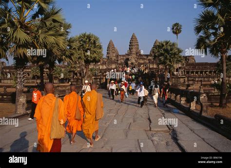 Cambodia Siem Reap Province Angkor Wat Buddhist Monks And Tourists