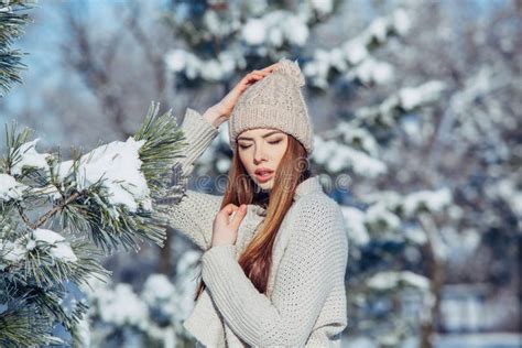 Beautiful Winter Portrait Of Young Woman In The Snowy Scenery Stock