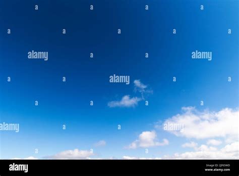 Blue Sky Background White Fluffy Clouds Above Horizon Sunny Summer