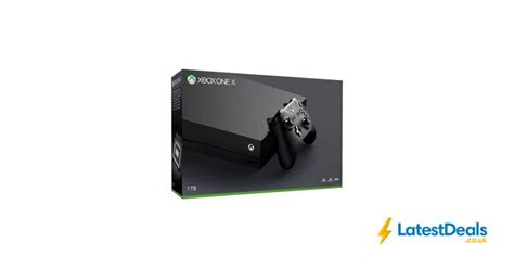 an image of a black xbox game console with the box on it's side