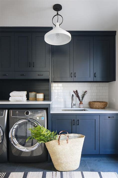 Dark Blue Flat Front Laundry Cabinets With Brass Hardware