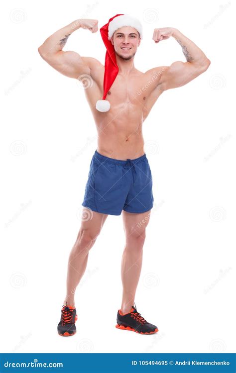 Handsome Athletic Guy With Naked Torso And Santa Hat Posing Showing