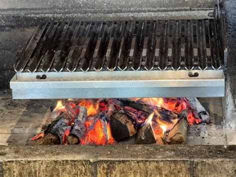 Real Wood Stove With Glowing Fire And Hot Ash Coal Ready To Grill Stock