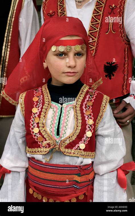 Kosovan girl in colorful traditional dress in a festival in Prishtine ...