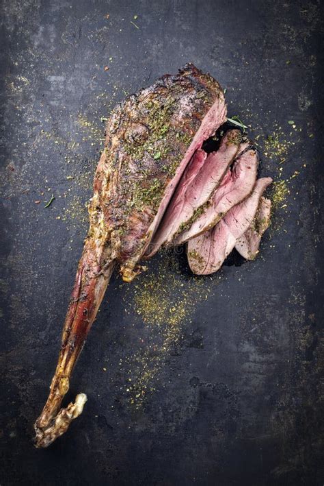 Traditional Barbecue Haunch Of Venison With Spicy Rub On An Old Rustic