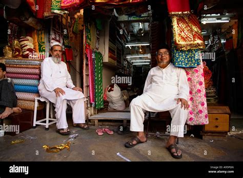 Muslim Shop Merchants relax outside their fabric shops, Ahmedabad ...