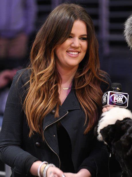 2012: Back to brunette for 2012. Khloe is all smiles as she rocks a ...