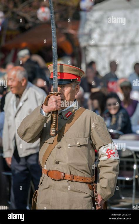 Right wing Japanese men dressed in old imperial army military uniforms ...