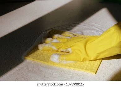 Hand Yellow Rubber Glove Washing Surface Stock Photo 1373930117